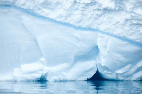 Soft blue and white ice textures on an iceberg facade near Cuverville Island, Antarctic Peninsula — fine art landscape photograph by Peter Cox