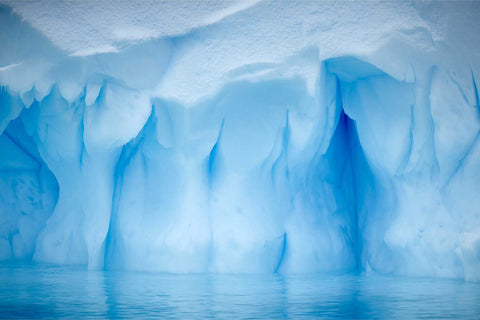 Textured iceberg detail showing light and shadow on sculpted ice near Cuverville Island, Antarctic Peninsula — fine art landscape photograph by Peter Cox
