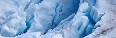 Panoramic close-up of deep blue crevasses in a glacier front at Svalbard, fine art landscape photograph by Peter Cox
