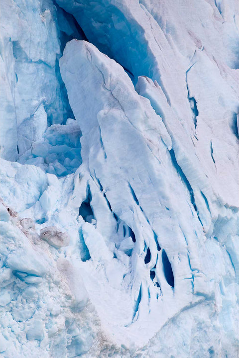 Close-up detail of towering glacier formations in soft blues and whites at Svalbard, fine art landscape photograph by Peter Cox