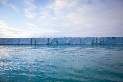 Abstract view of Brasvellbreen glacier ice wall meeting the ocean, Svalbard — fine art landscape photograph by Peter Cox