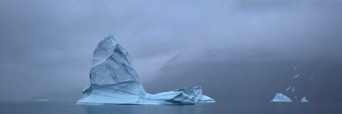 A solitary iceberg rising from foggy waters in Greenland's narrows — fine art landscape photograph by Peter Cox