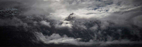Dramatic clouds over towering cliffs and fjords in Greenland, fine art landscape photograph by Peter Cox