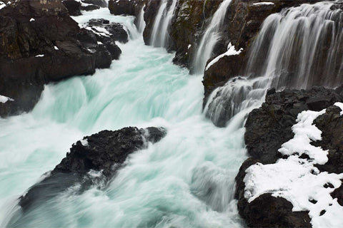 Barnafoss waterfall rushing through a snowy canyon, Iceland — fine art landscape photograph by Peter Cox