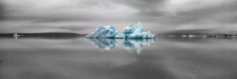 Blue iceberg in black and white panorama at Jokulsarlon Glacier Lagoon, Iceland — fine art landscape photograph by Peter Cox