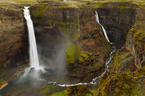 Haifoss waterfall plunging into a deep canyon with green moss-covered cliffs, Iceland — fine art landscape photograph by Peter Cox