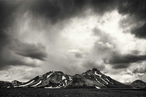 Black and white mountain rising from black sand desert, Fjallabak, Iceland, fine art landscape photograph by Peter Cox