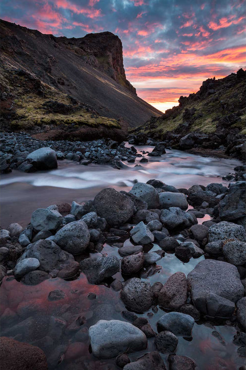 River winding through Hreggnasi Canyon on the Snaefellsnes peninsula under a colourful midnight sun sky
