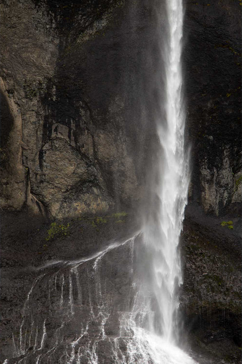 Waterfall cascading down dark cliffs at Foss a Sidu, Iceland, fine art landscape photograph by Peter Cox