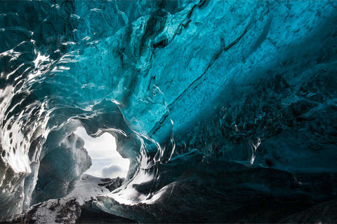 Deep blue swirling ice formations inside an ice cave at Breidamerkursjokull glacier, Iceland — fine art landscape photograph by Peter Cox