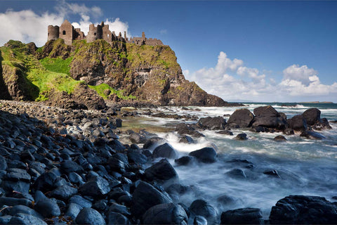 Dunluce Castle on coastal cliffs with long exposure sea, Co. Antrim, fine art landscape photograph by Peter Cox