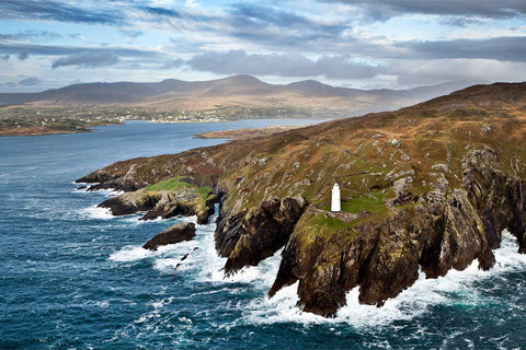 Ardnakinna Lighthouse on Bere Island, Co. Cork, with mountains and coastline — fine art aerial photograph by Peter Cox