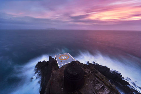 Pink dawn light from the Fastnet Lighthouse balcony looking towards Cape Clear Island, Co. Cork, Ireland, fine art landscape photograph by Peter Cox