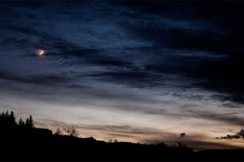 Crescent moon with earthshine in the night sky over mountains, Ballingeary, Co. Cork, Ireland, fine art landscape photograph by Peter Cox