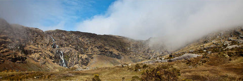 The Mare's Tail waterfall cascading through cloud-wrapped mountains on the Beara Peninsula, County Cork