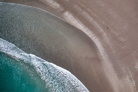 Aerial view of waves creating patterns on the sandy shore at Inchydoney Strand, Co. Cork — fine art aerial photograph by Peter Cox