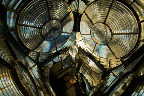 View looking down inside the rotating lantern of the Fastnet Lighthouse showing twin bulbs and glass prisms