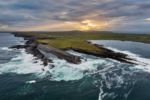 Aerial view of Ross Bay and the Bridges of Ross coastline just after sunrise in County Clare