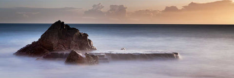 Long exposure panoramic view of the White Rock swimming platform at Killiney Bay, Dublin, floating in misty high-tide waters