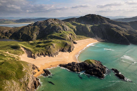 Aerial view of Boyeeghter Strand with turquoise waters and rugged cliffs, Co. Donegal, Ireland — fine art aerial photograph by Peter Cox