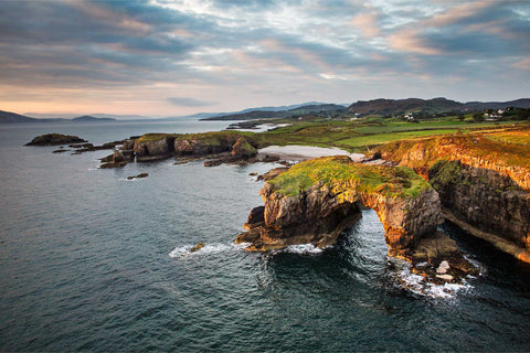 Great Pollet Arch flooded with morning sunrise light, Co. Donegal — fine art aerial photograph by Peter Cox