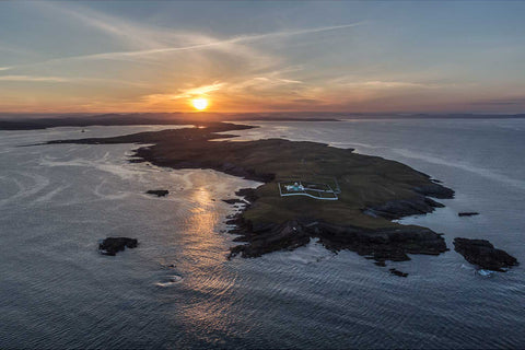 Aerial view of St. John's Point peninsula and lighthouse at sunrise on a calm summer morning, Donegal