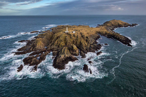 Aerial view of Inishtrahull, Ireland's northernmost island, with lighthouse and rugged coastline, Co. Donegal — fine art aerial photograph by Peter Cox