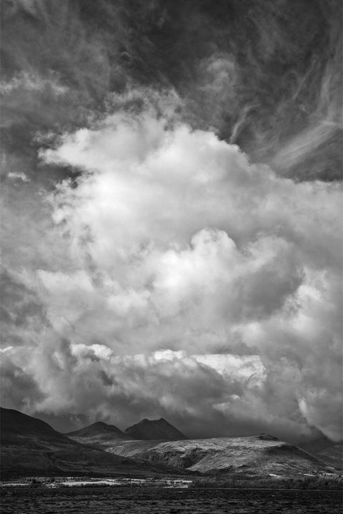 Dramatic clouds towering over the MacGillycuddy's Reeks and Lough Leane in black and white, Killarney, Kerry