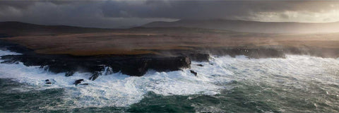 Aerial view of Valentia Island's north coast being battered by storm waves, Kerry