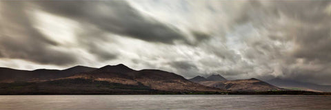 Long exposure of Lough Leane looking toward the MacGillycuddy's Reeks under dark clouds, Killarney, Kerry