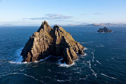 Aerial view of Skellig Michael rising from the Atlantic with the Small Skellig and Kerry coast in the distance