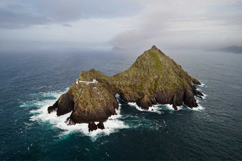 Aerial photograph of An Tiaracht, Blasket Islands, Co. Kerry, Ireland, with lighthouse and cliffs by Peter Cox