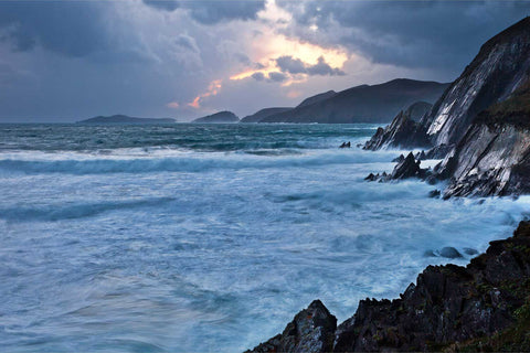 Dramatic sunset colours breaking through storm clouds over Slea Head and the Blasket Islands, Dingle Peninsula, Kerry