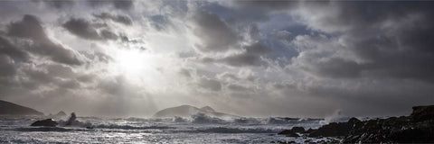 Storm clouds with sunlight breaking through over the Great Blasket Island and turbulent Atlantic seas, Kerry