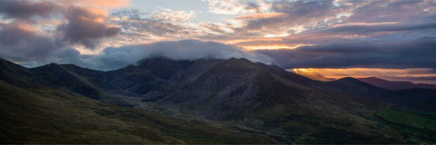 The Macgillycuddy's Reeks mountain range seen from the air at sunset in golden September light, County Kerry