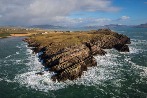 Aerial view of Boolakeel Creek coastal inlet with snow-capped Reeks, Co. Kerry, Ireland — fine art aerial photograph by Peter Cox