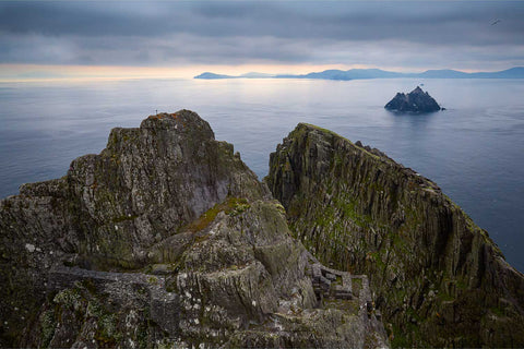 Aerial view of the ancient hermitage clinging to Skellig Michael's South Peak with the monastery and Kerry coast beyond