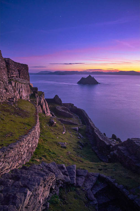 Pre-dawn twilight illuminating the monk's garden on Skellig Michael with the Small Skellig silhouetted beyond