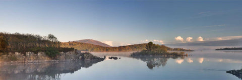 Early morning light and mist over Lough Conn with Nephin mountain rising beyond forested shores, County Mayo