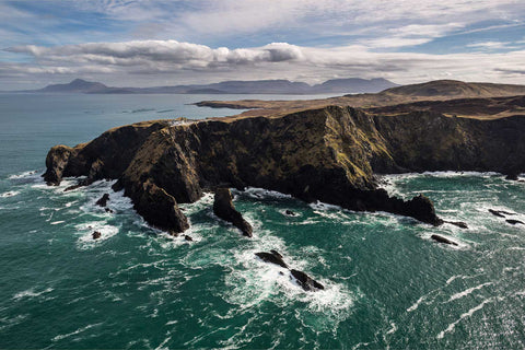 Aerial view of lighthouse on dramatic sea cliffs, Clare Island, Co. Mayo, fine art aerial photograph by Peter Cox