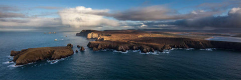 Aerial panorama of Benwee Head cliffs and coastline with rain squalls, Co. Mayo, Ireland — fine art aerial photograph by Peter Cox