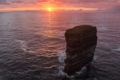 Aerial view of Dun Briste sea stack bathed in golden sunset light, Downpatrick Head, Co. Mayo, fine art landscape photograph by Peter Cox