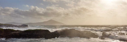 Storm battering Achill Island with sheep grazing on a small islet in the foreground, Mayo