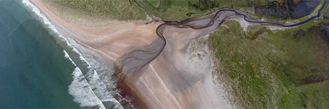 Aerial view of a stream winding across a beach to the sea, Co. Sligo, Ireland — fine art landscape photograph by Peter Cox
