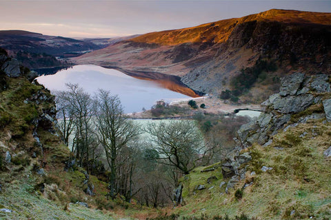 Dawn light illuminating the crags of Luggala above Lough Tay, Co. Wicklow, Ireland, fine art landscape photograph by Peter Cox