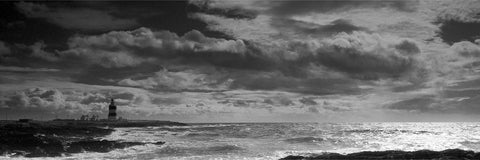 Black and white panoramic of Hook Head lighthouse and wild sea under brooding skies, Co. Wexford — fine art landscape photograph by Peter Cox