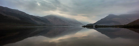 Dawn breaking over Loch Leven with the Pap of Glencoe reflected in still waters, Scottish Highlands