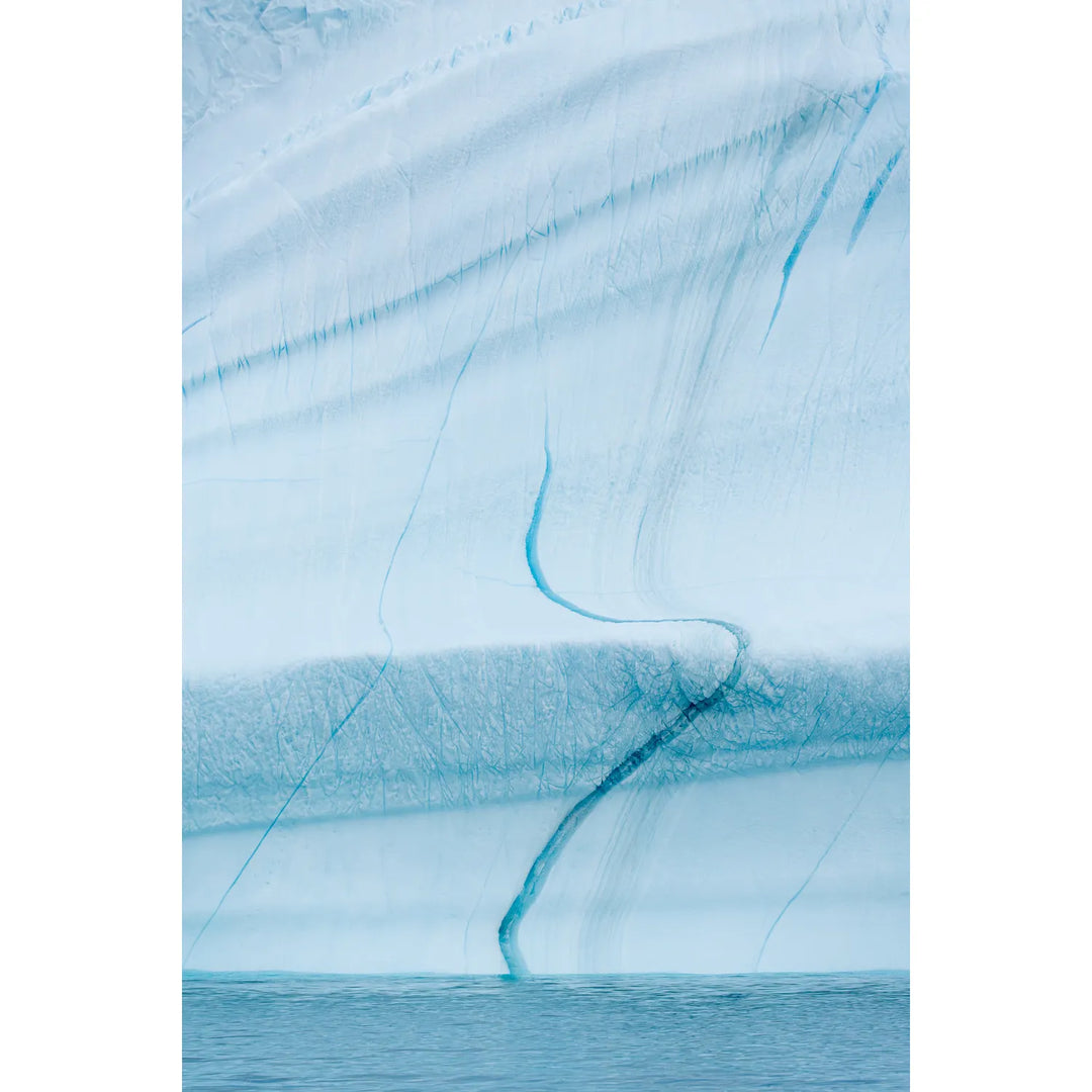 Blue fissures and fracture lines in Greenland iceberg face, Scoresby Sound, fine art landscape photograph by Peter Cox