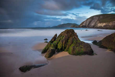 Long exposure evening light on moss-covered rocks at Coumeenoole Beach, Dingle, Kerry, fine art landscape photograph by Peter Cox